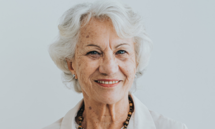 a senior woman smiling at the camera