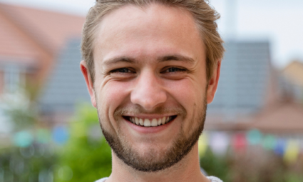 a man smiling for a picture