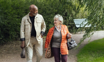 A man and woman walking on a path