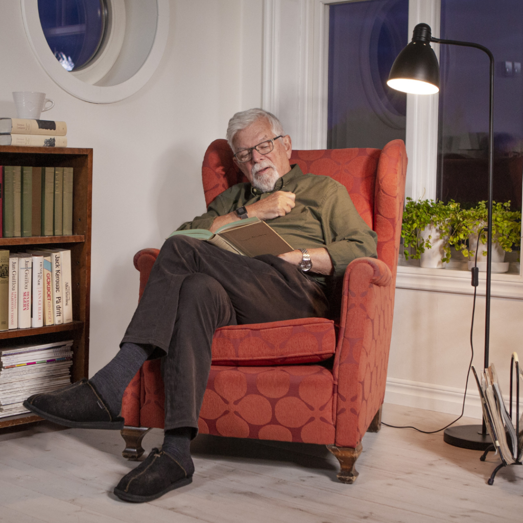man sitting reading book