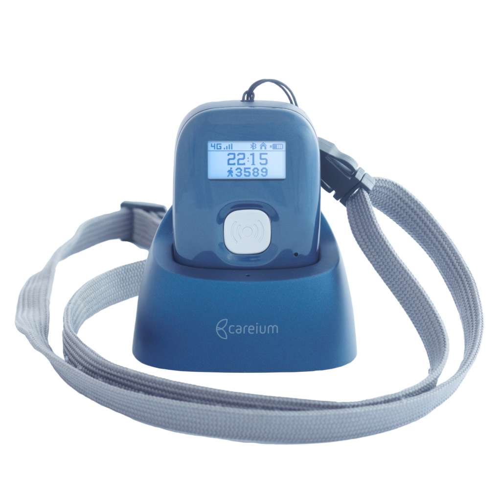 Abby mobile social alarm in charging cradle with grey strap