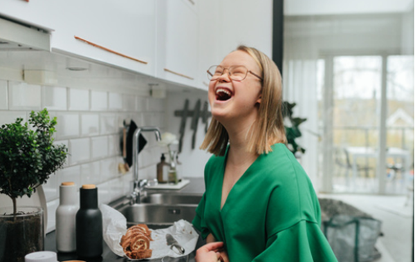Young girl smiling in kitchen