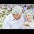 Couple with flowers in background