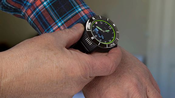 Senior with GPS watch around wrist