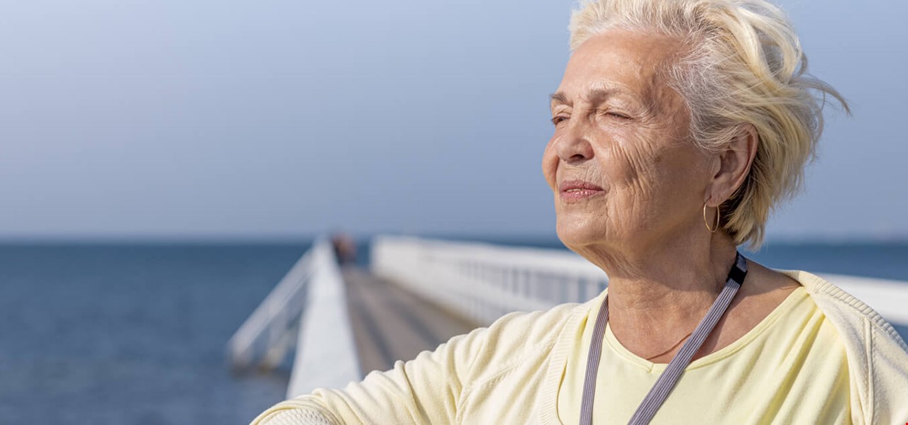 Senior woman smiling outdoors