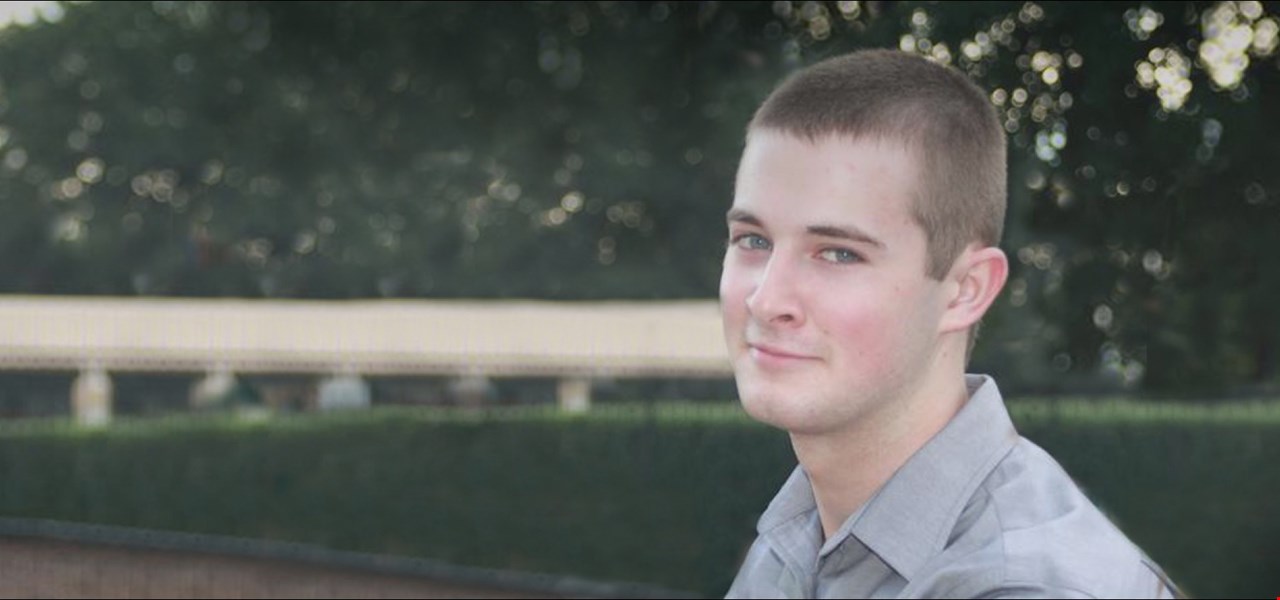 Young man smiling and looking at camera